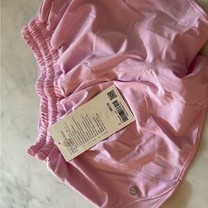 New with tags, never worn, Lululemon hottie hot pink low rise, size 2